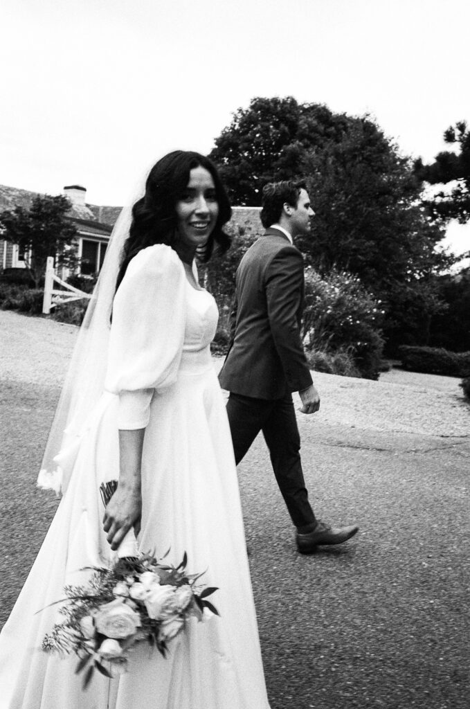 Couple walking on wedding day by New England wedding film photographer Chris Mongeau