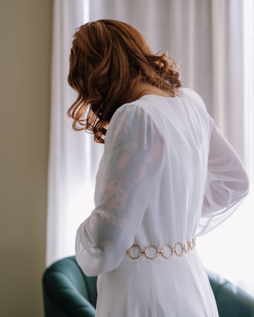 Bride and groom getting ready during winter elopement in the White Mountains