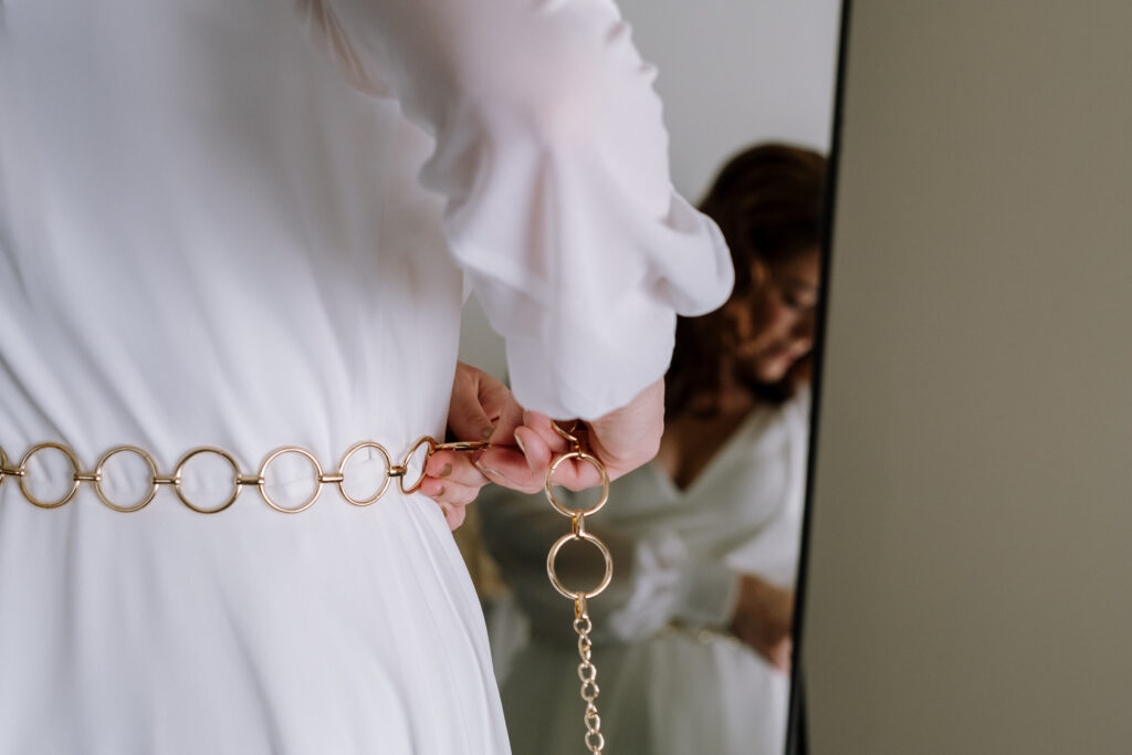 Bride and groom getting ready during winter elopement in the White Mountains