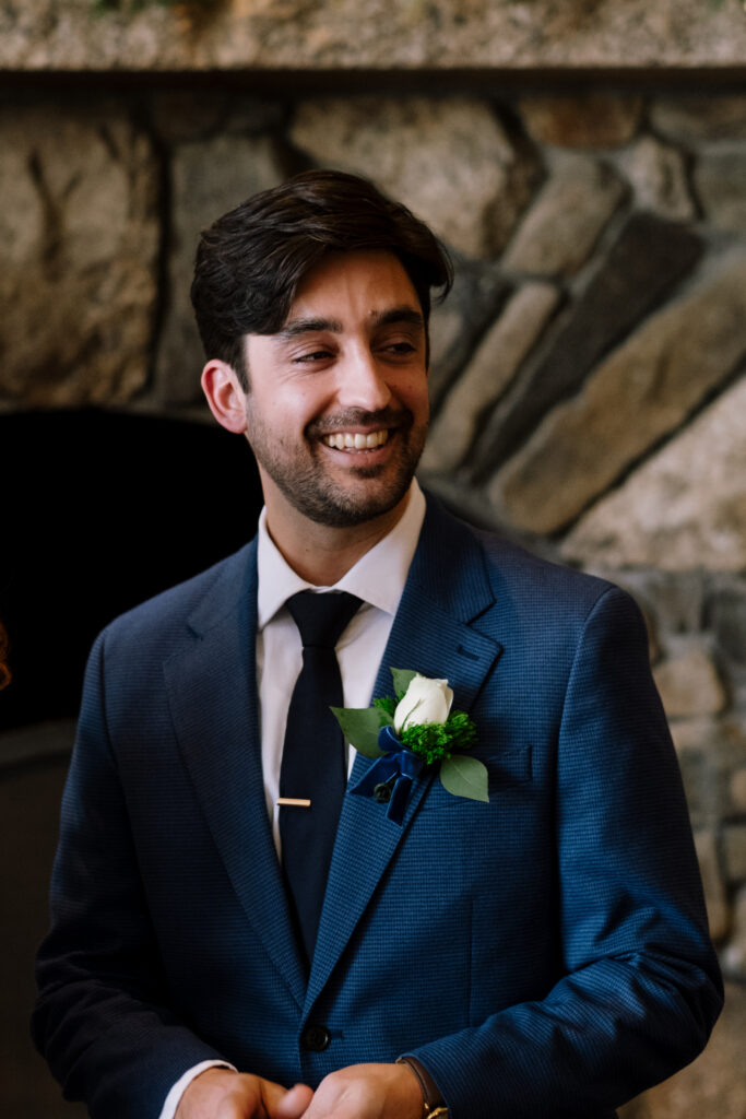 Cozy, fireplace ceremony for winter elopement in the white mountains