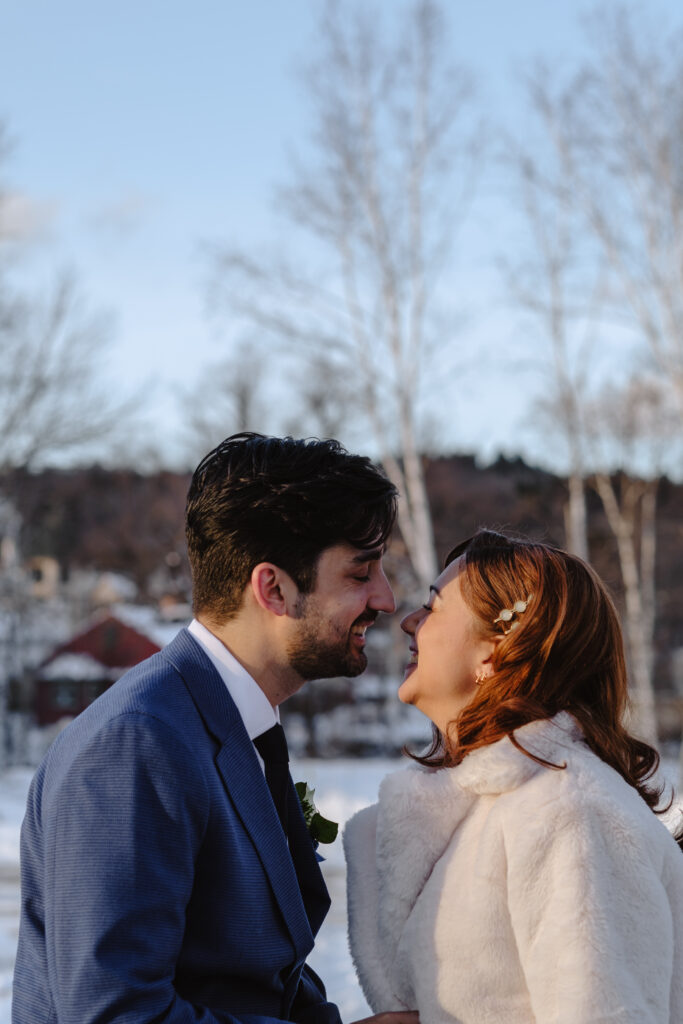 Bride and groom on Conway Scenic Railway during winter elopement in the White Mountains