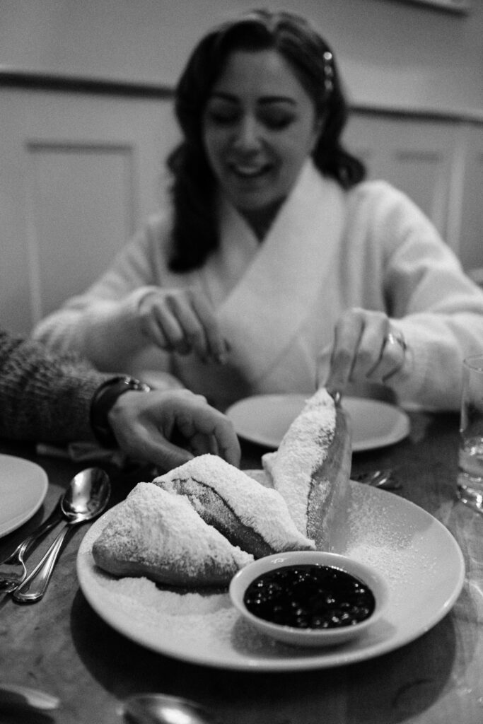 Bride and groom eating dinner at farm to table restaurant in New England