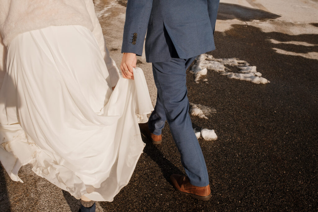 Bride and groom walking in the snow