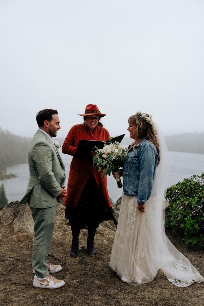 Bride and groom sharing vows during their Emerald Bay elopement at Lake Tahoe