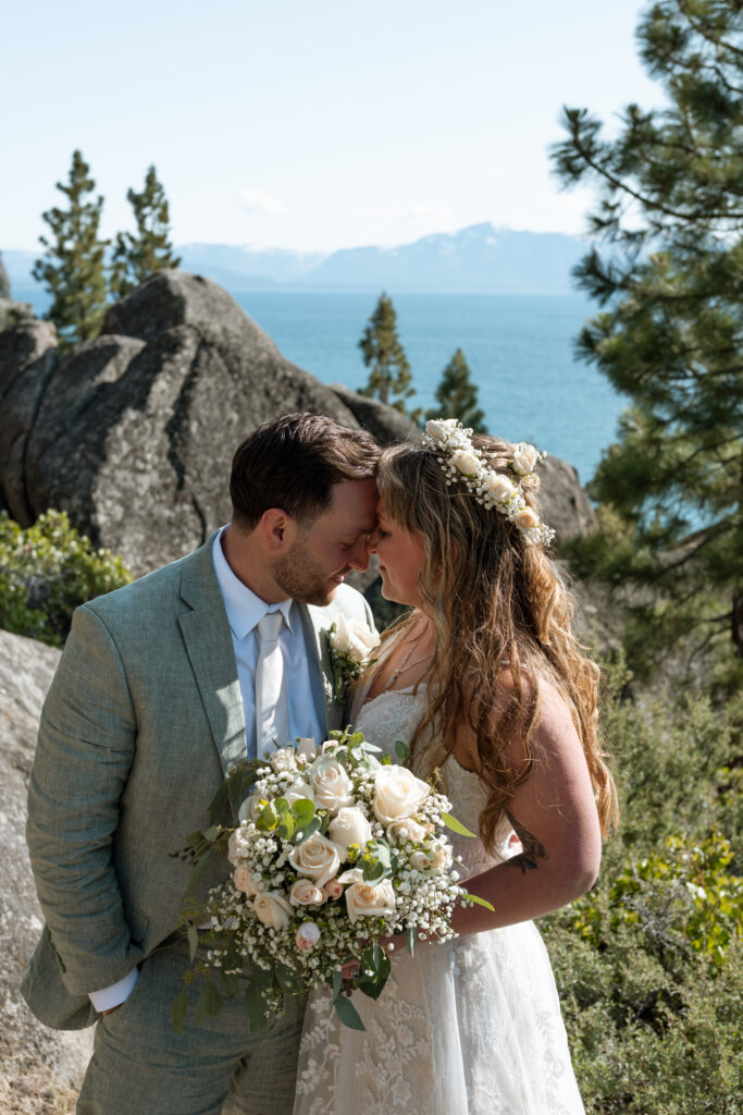 Lake Tahoe cliffs behind couple embracing
