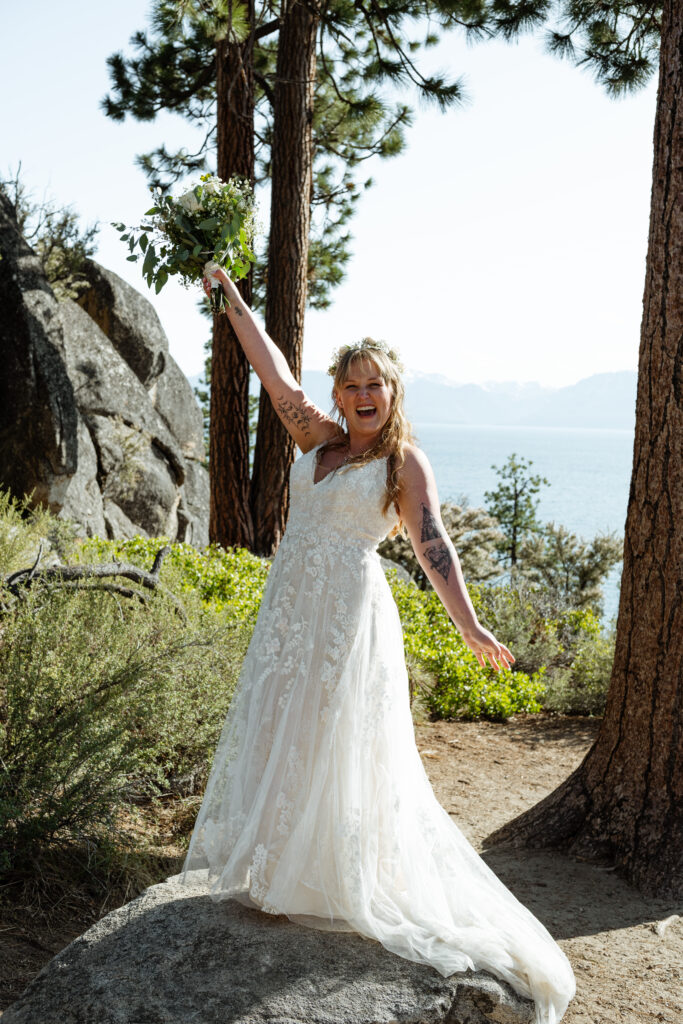 Bride dancing at an overlook on Lake Tahoe
