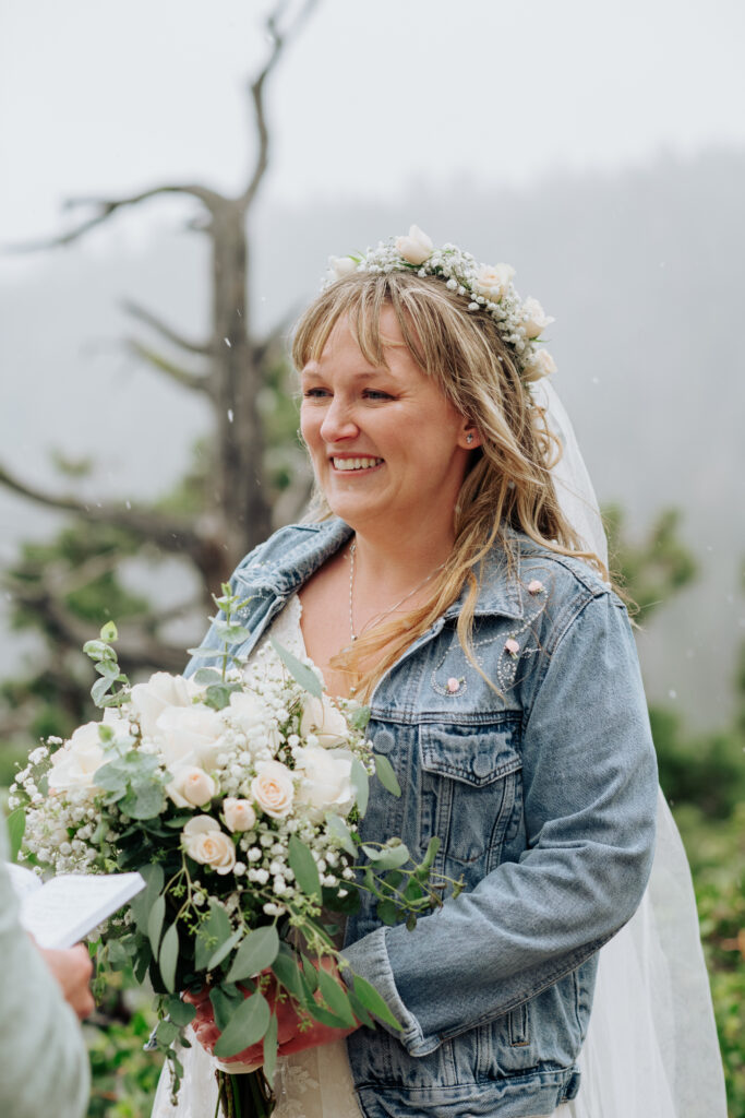 Bride and groom sharing vows during their Emerald Bay elopement at Lake Tahoe