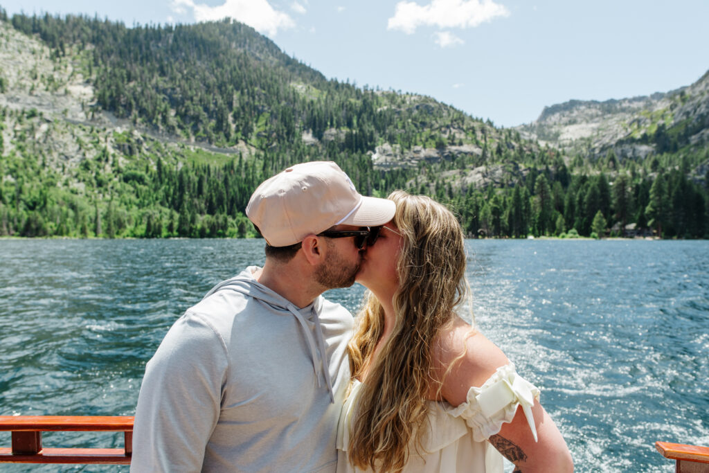 Couple kissing on a boat after an Emerald Bay elopement